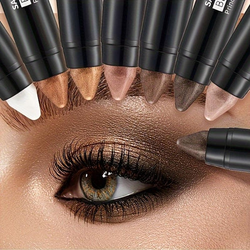 Seven waterproof eye shadow sticks by Cosmetolux in matte and pearlescent shades, displayed in a sleek set.