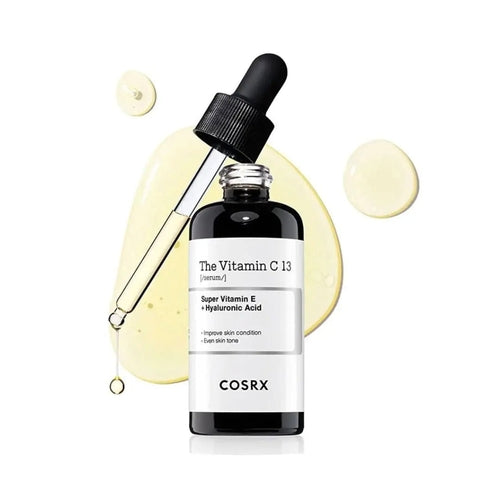 Cosmetolux COSRX The Vitamin C 13 Serum in a clear glass bottle with dropper, showcasing brightening skincare formulation.