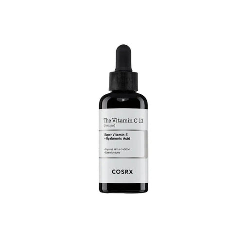 Cosmetolux COSRX The Vitamin C 13 Serum bottle with dropper, featuring bright orange packaging and clear labeling.
