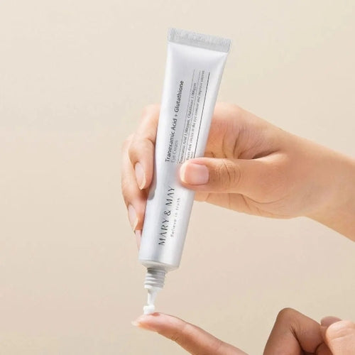 Three tubes of Cosmetolux Tranexamic Acid and Glutathion Eye Cream showing the product packaging and applicator tips.